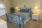 Beautiful Island Decorated Guest Bedroom with Queen Bed